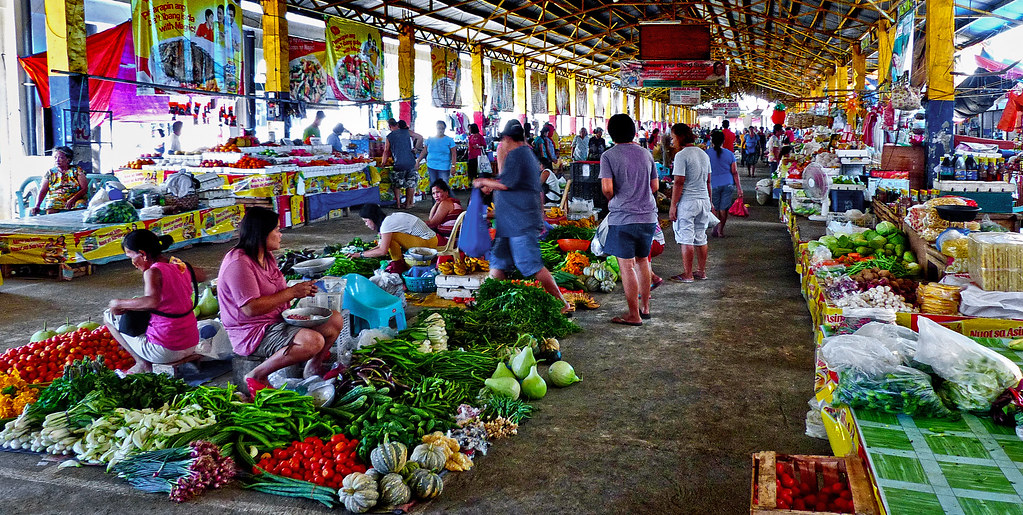 Produce market. Batac City. Philippines. — illustrating Every business is one geek away from being uberized. Cite Jeff Cline